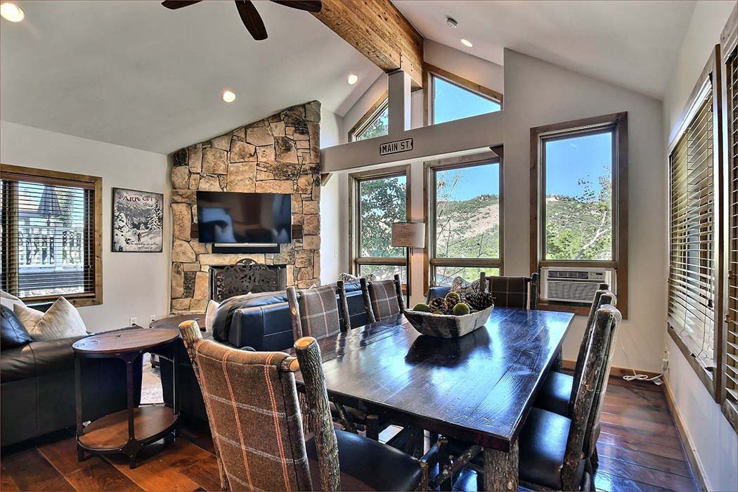 Park City vacation rental features a large family dining room with views of the slopes!