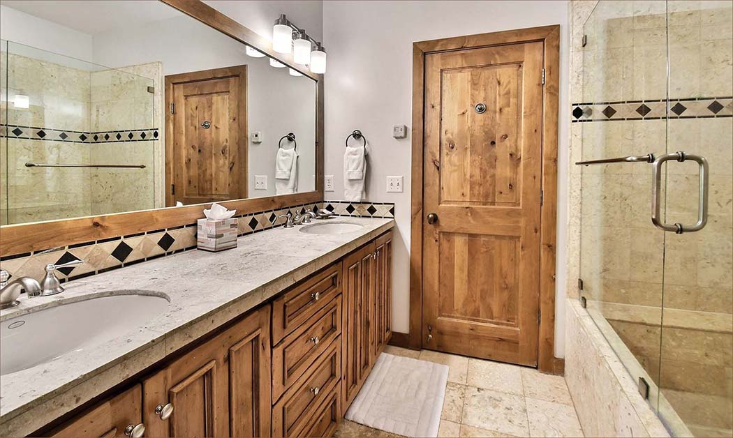 Generous master bathroom with twin basin vaniety and separate shower.