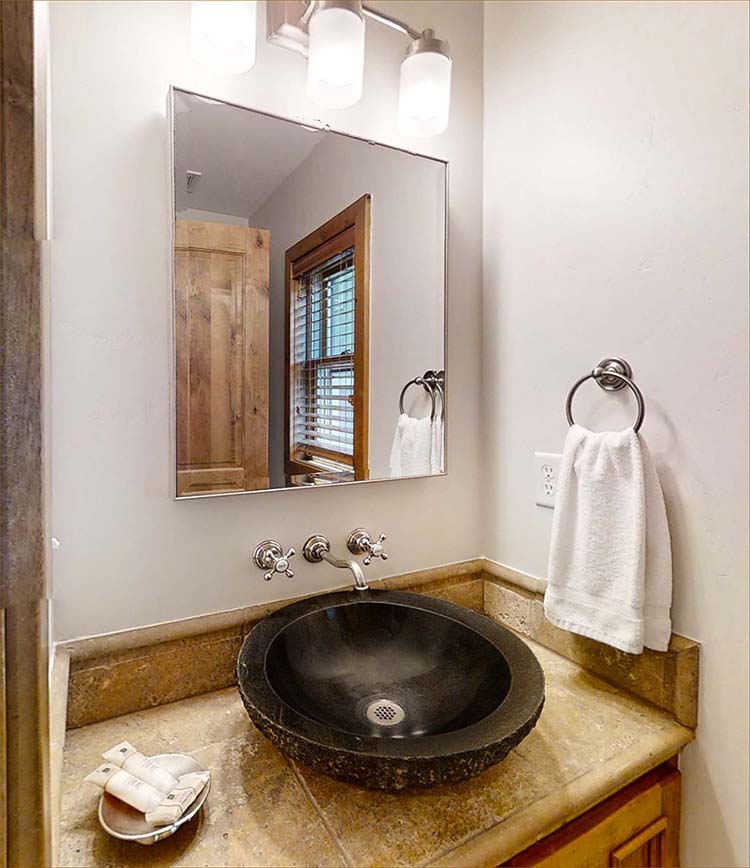 This lovely vessel sink is the focal point of the convenient powder room on the main level