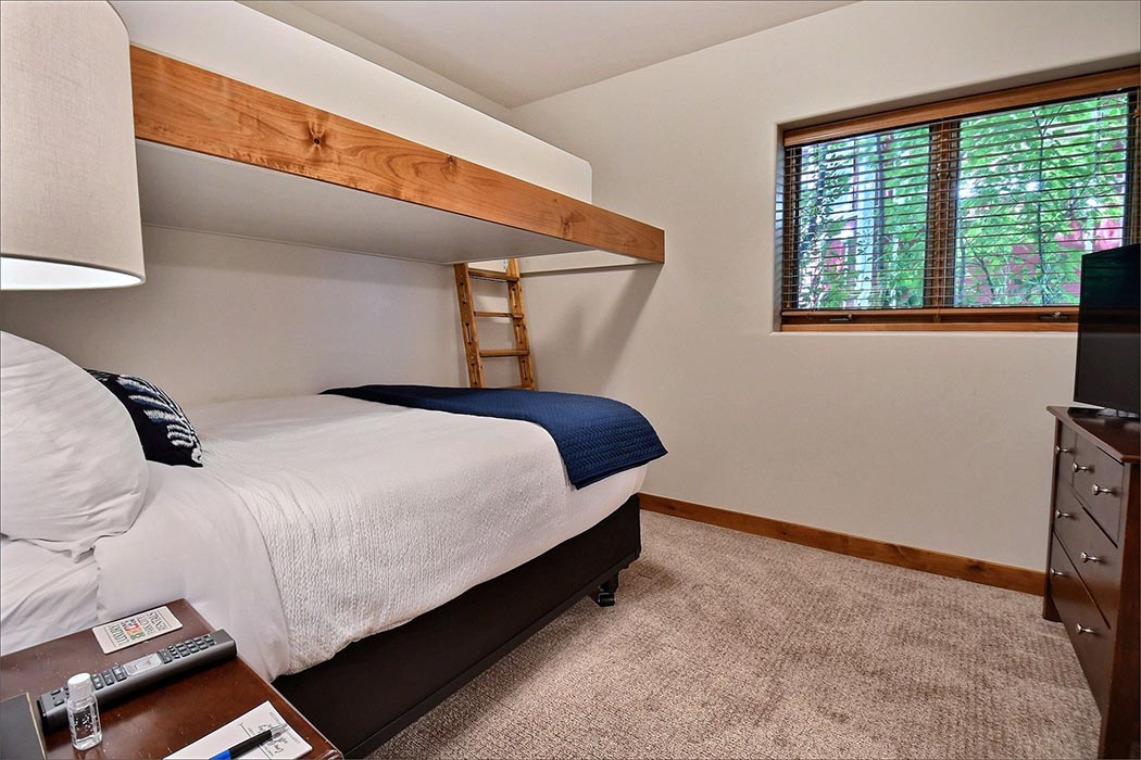 The 3rd guestroom includes a twin over queen bunk bed plus a double bed.