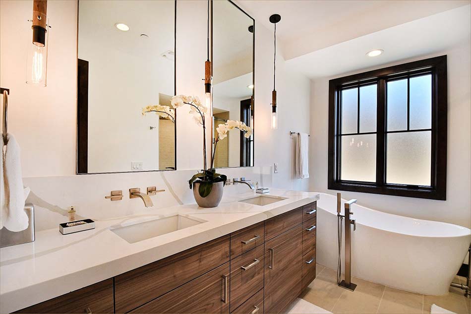 Extra luxurious master bathroom includes twin sinks, closets, and an oversized, soaking bath tub and separate, walk in shower.