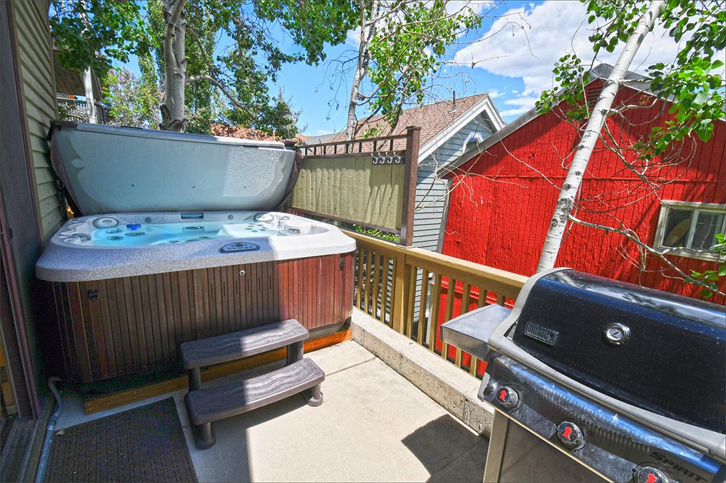Outdoor private hot tub on the deck right outside the master bedroom.