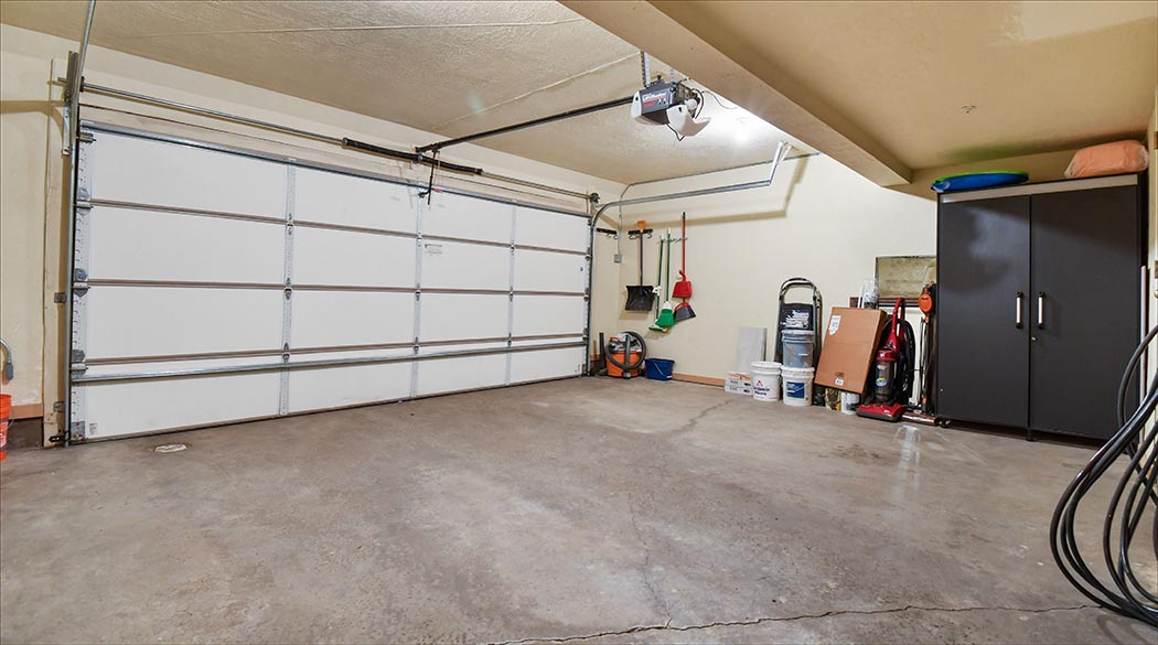 Attached single car heated garage with ski, board and gear storage.