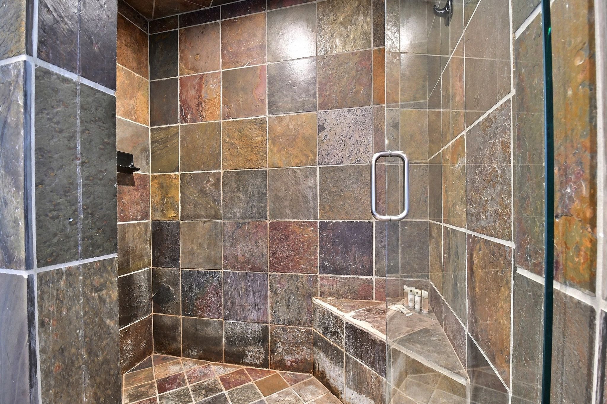 Ensuite master bathroom features a huge slate shower.