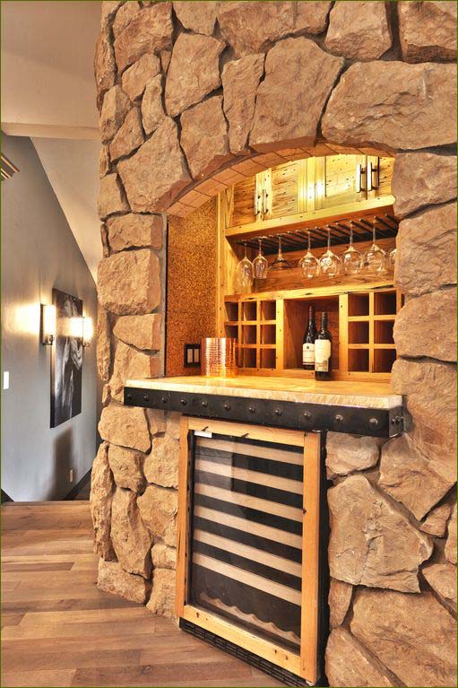 Large gourmet kitchen with professional appliances including a wine cooler