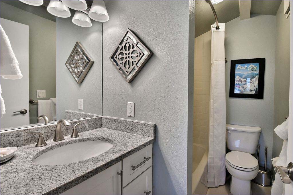 Kids bathroom with shower and tub.
