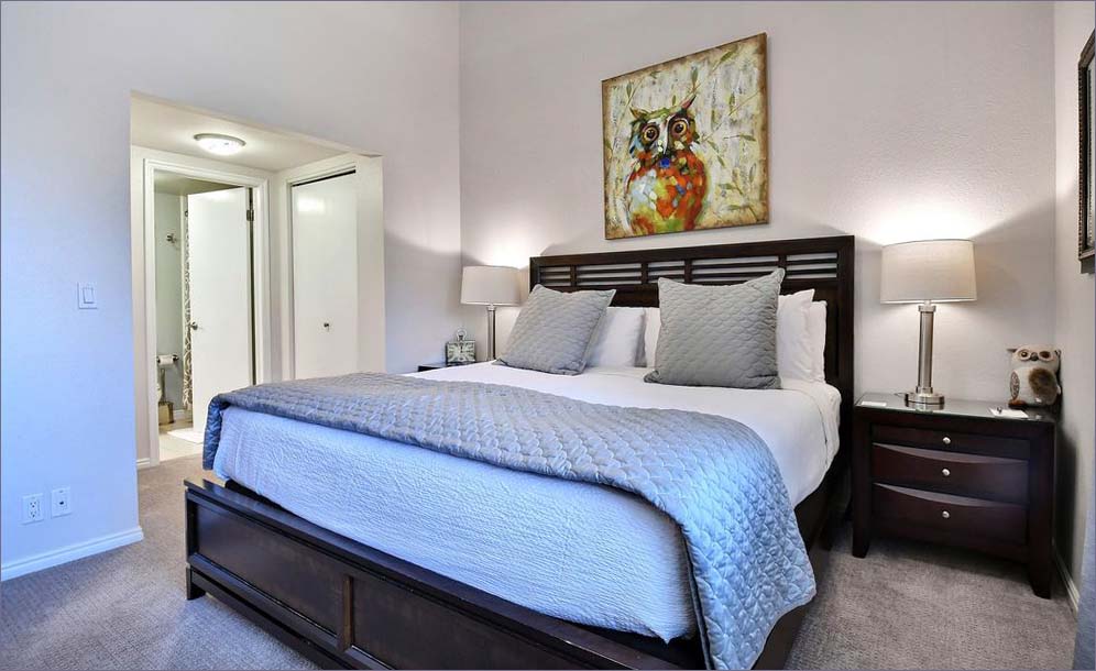 The master bedroom features a king sized bed.