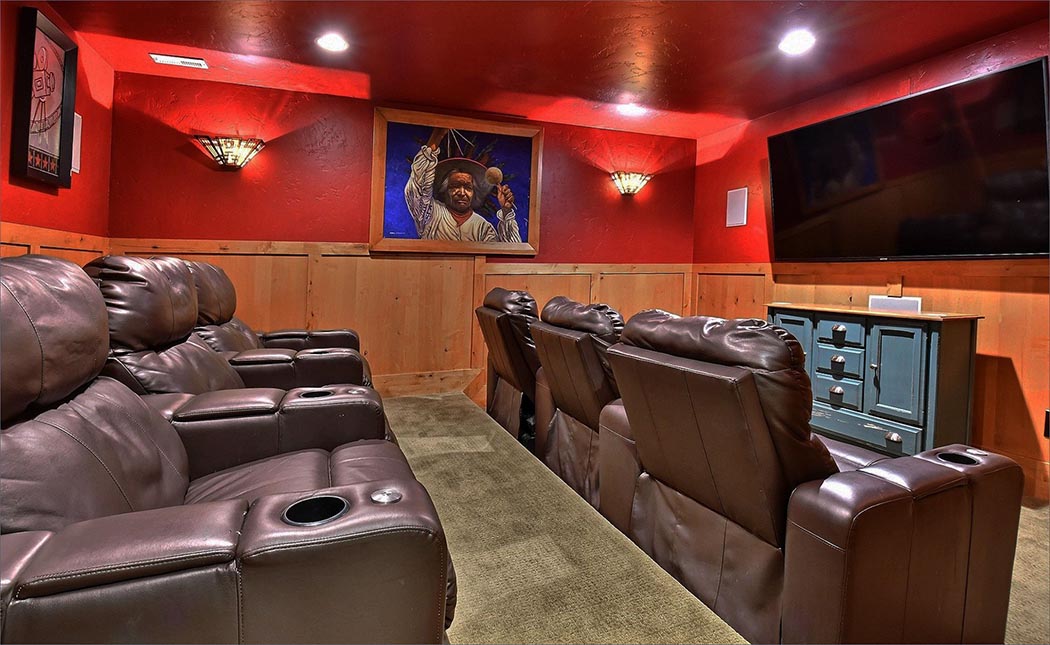Delightful home theater with luxurious leather theater seating, and state of the art surround sound.