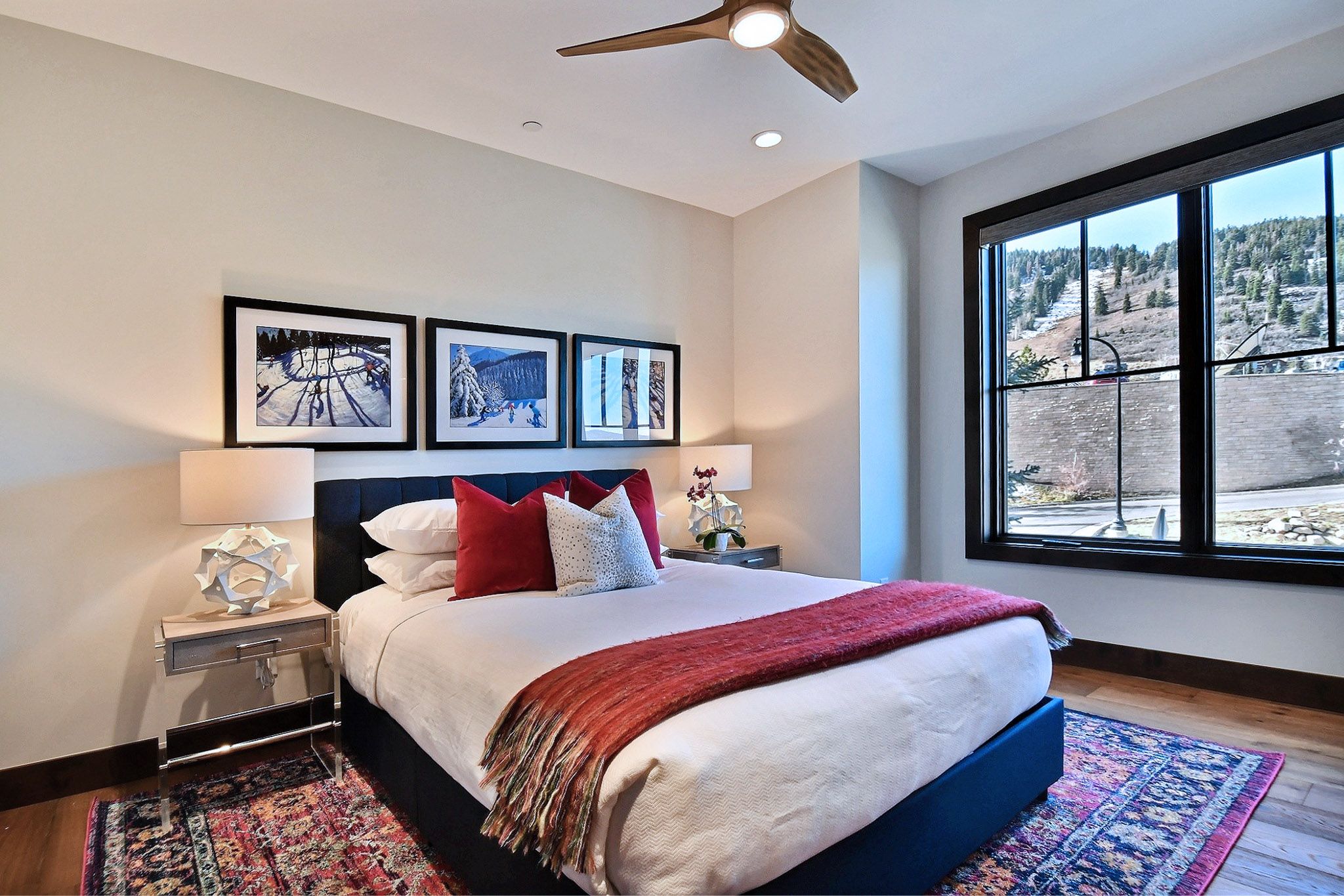 The third master bedroom suite features a queen bed, ceiling fan, HDTV and personal bathroom.