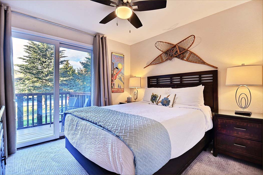The master guestroom with private HDTV, deck access and queen sized bed.