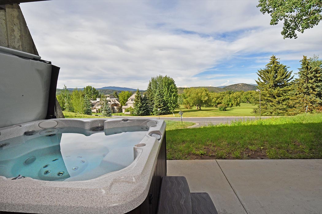 Private hot tub overlooking the rolling green of Park City.