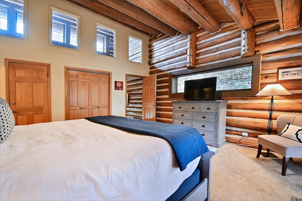 The master bedroom includes a king bed, private TV and bathroom.